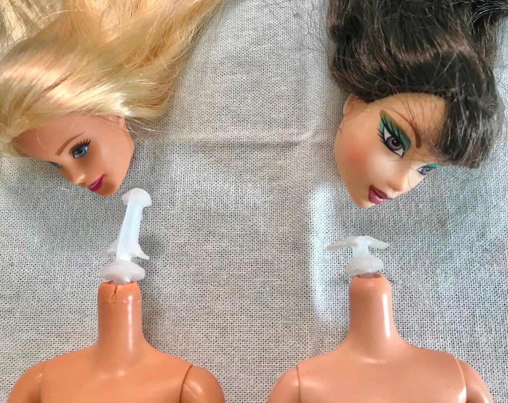 Removed Barbie and My Scene doll heads